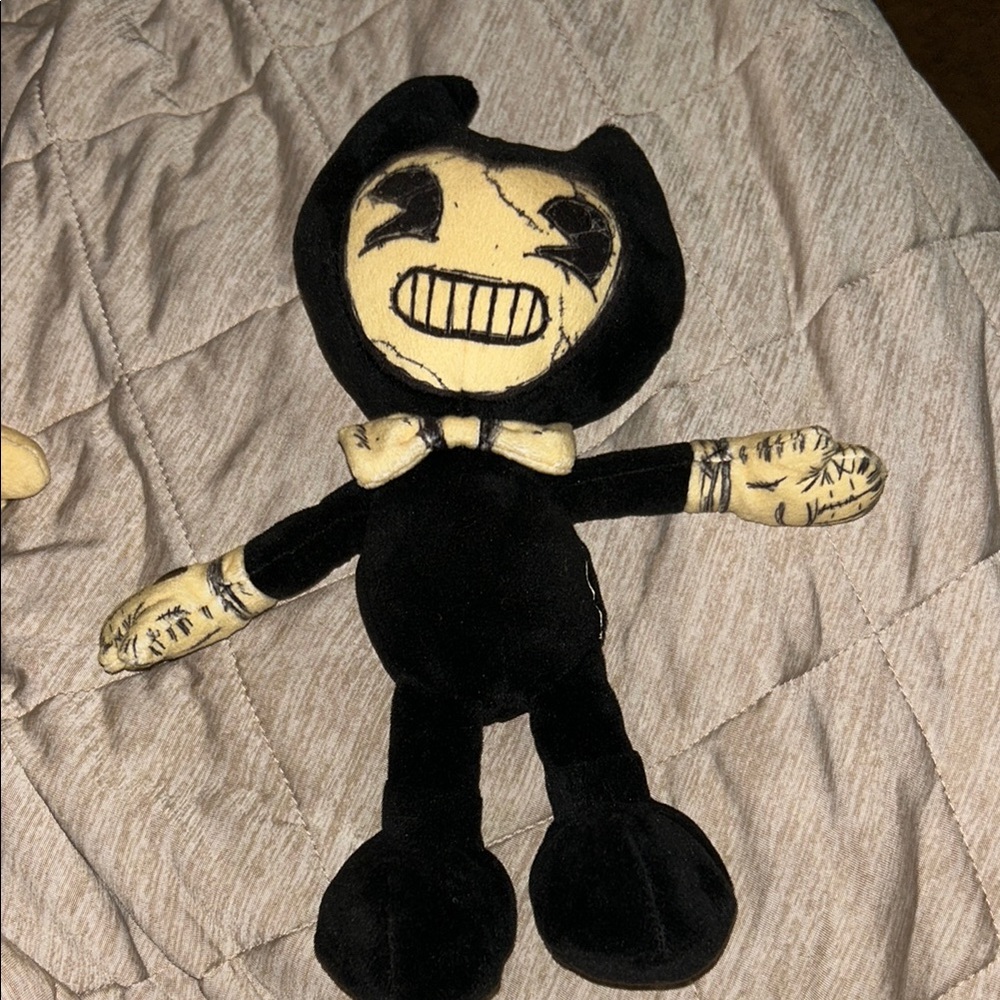 Black and Cream Stuffed Animal Toy